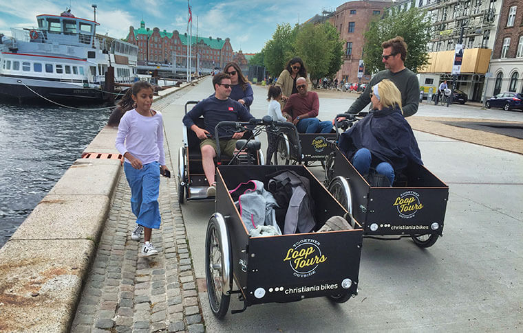 big family with kids on cargo bikes