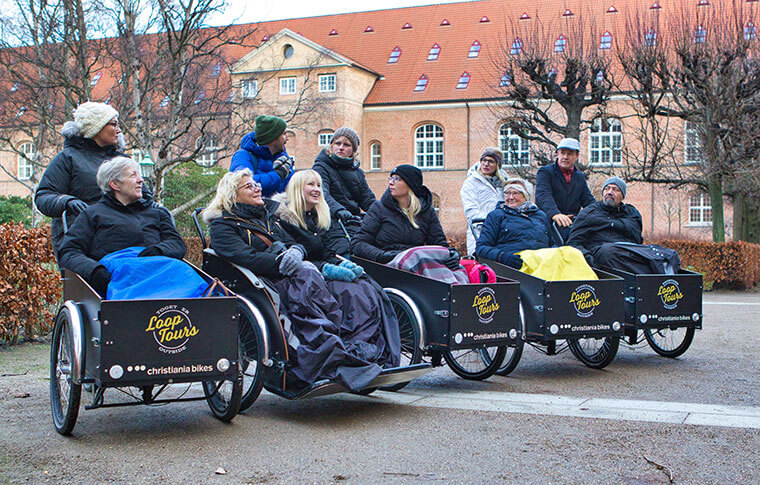 line of cargo bikes with people chatting